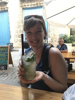Beth in Havana holding a mojitor