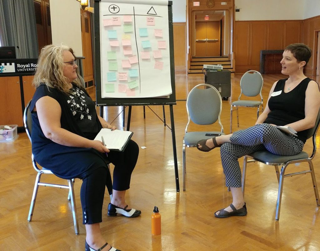 Tracy and Beth debriefing in fishbowl at RRU Quarterdeck